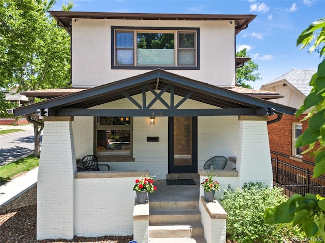 400 S Gilpin St, Denver, CO 80209 - view of front of home featuring a porch and brick siding
