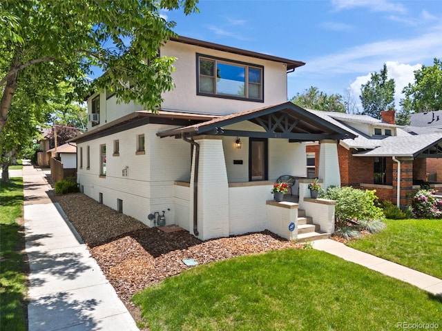 400 S Gilpin St, Denver, CO 80209 - view of front of property featuring a front yard, covered porch, and brick siding