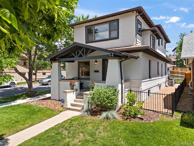 400 S Gilpin St, Denver, CO 80209 - american foursquare style home featuring covered porch, brick siding, and stucco siding
