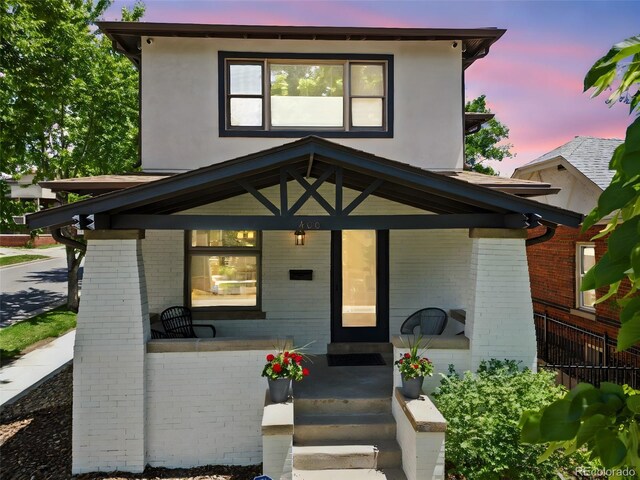 400 S Gilpin St, Denver, CO 80209 - view of front of house with brick siding and a porch