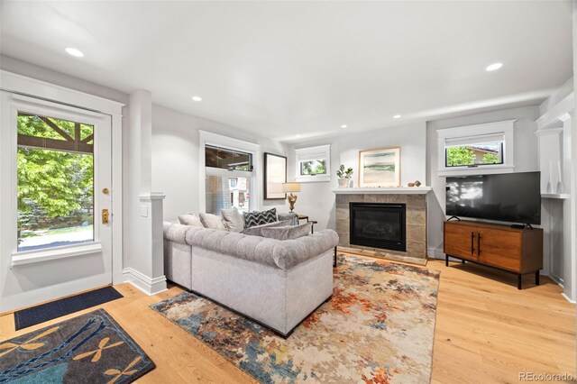 400 S Gilpin St, Denver, CO 80209 - living room featuring a tile fireplace, wood finished floors, and recessed lighting