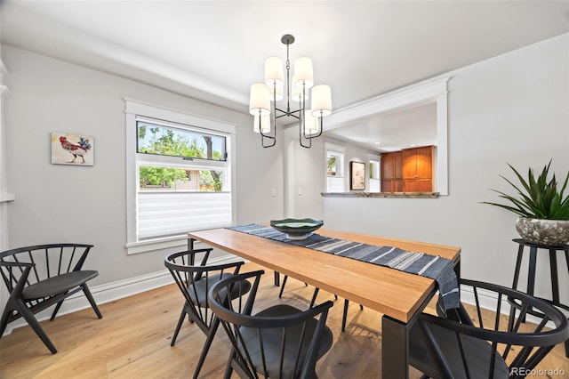 400 S Gilpin St, Denver, CO 80209 - dining space featuring a chandelier and light wood finished floors