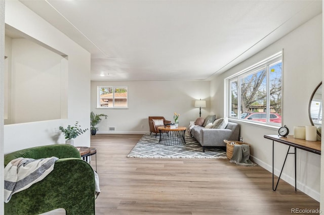 sitting room with wood finished floors and baseboards