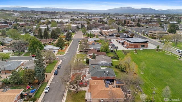 1155 W 4th Ave, Broomfield, CO 80020 - aerial view of property and surrounding area with a mountainous background and nearby suburban area