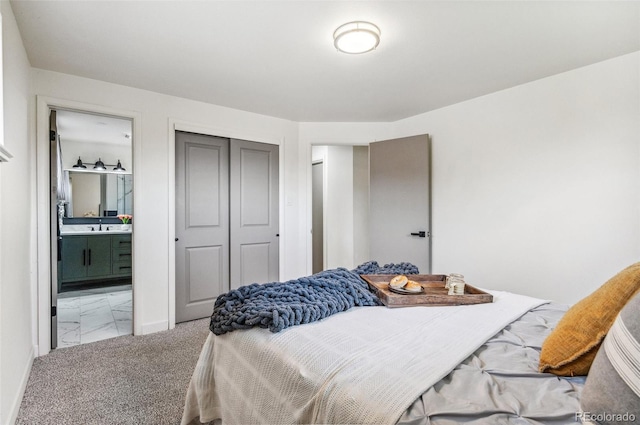 1155 W 4th Ave, Broomfield, CO 80020 - bedroom featuring a closet, ensuite bath, carpet, and baseboards