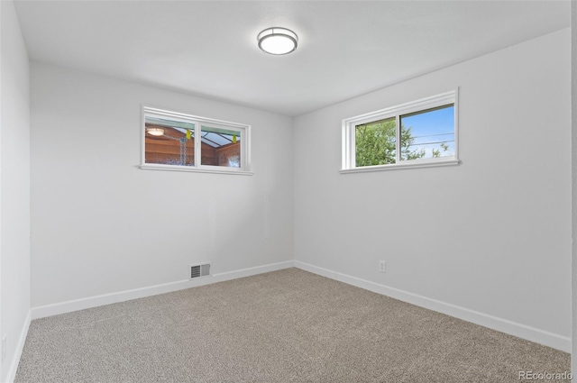 1155 W 4th Ave, Broomfield, CO 80020 - carpeted empty room with baseboards