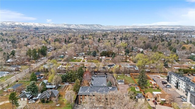 birds eye view of property featuring a mountain view