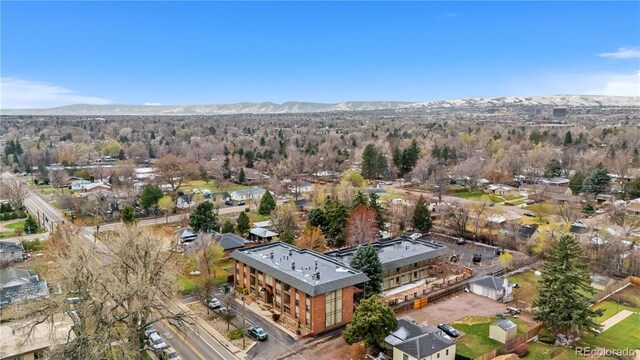 birds eye view of property with a mountain view