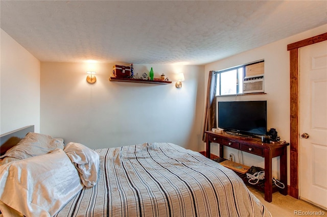 carpeted bedroom with a textured ceiling