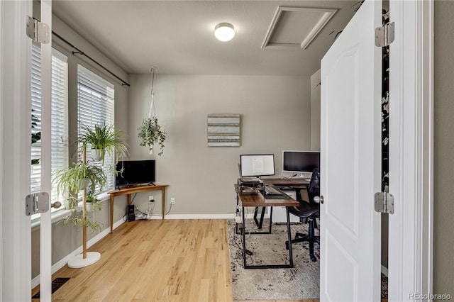 office space with light hardwood / wood-style floors