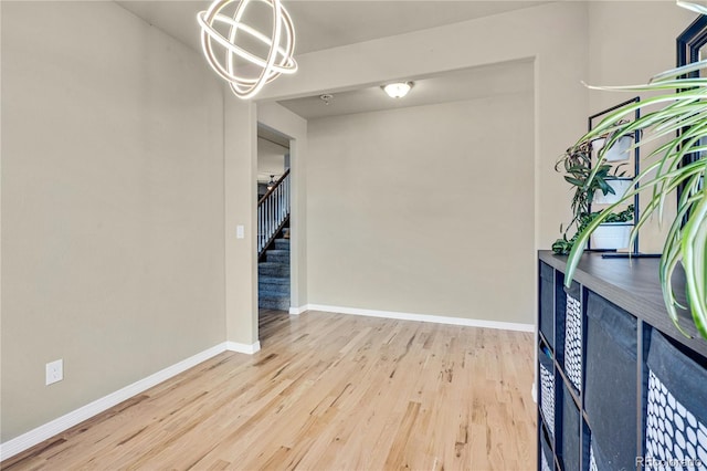 interior space with a chandelier and light wood-type flooring