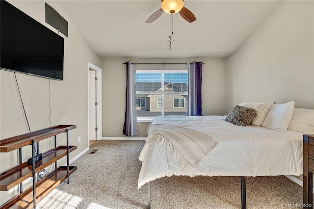 bedroom with vaulted ceiling, carpet floors, and ceiling fan