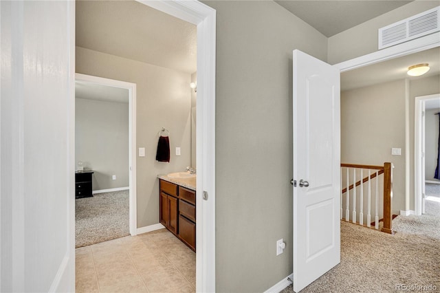 bathroom with vanity and tile patterned floors