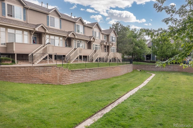 5555 E Briarwood Ave Unit 1404, Centennial, CO 80122 - view of community featuring stairs, a lawn, and a residential view