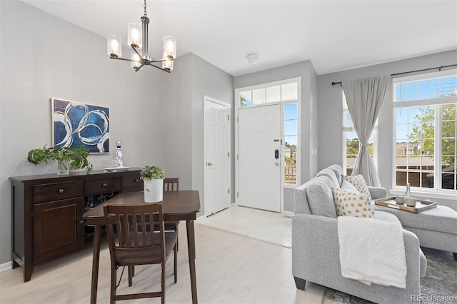 5555 E Briarwood Ave Unit 1404, Centennial, CO 80122 - foyer entrance with a chandelier and light wood finished floors