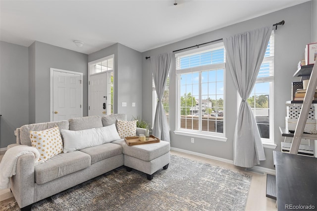 5555 E Briarwood Ave Unit 1404, Centennial, CO 80122 - living room featuring baseboards and healthy amount of natural light