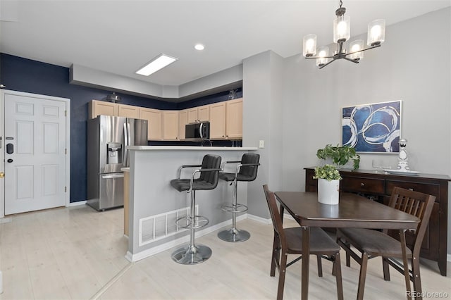 5555 E Briarwood Ave Unit 1404, Centennial, CO 80122 - dining area with light wood-style flooring, a chandelier, baseboards, and recessed lighting