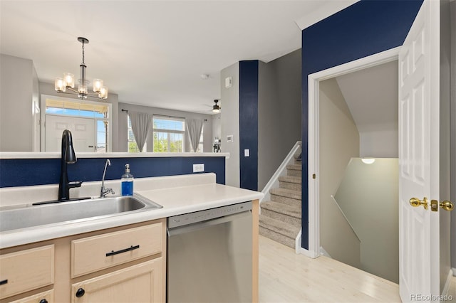 5555 E Briarwood Ave Unit 1404, Centennial, CO 80122 - kitchen featuring stainless steel dishwasher, a sink, light wood-type flooring, a chandelier, and hanging light fixtures