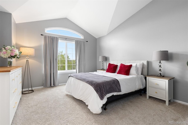 5555 E Briarwood Ave Unit 1404, Centennial, CO 80122 - bedroom with vaulted ceiling, light carpet, and baseboards