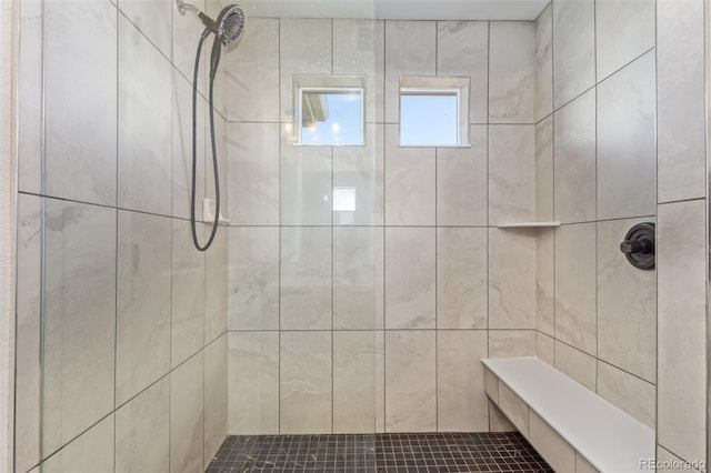 bathroom with tiled shower