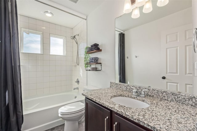 full bathroom featuring vanity, toilet, and shower / bath combo with shower curtain