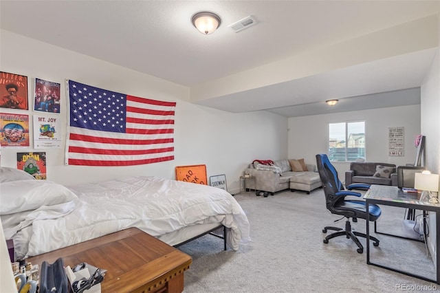 carpeted bedroom featuring visible vents