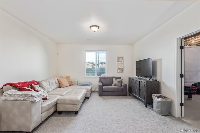 living room featuring light carpet