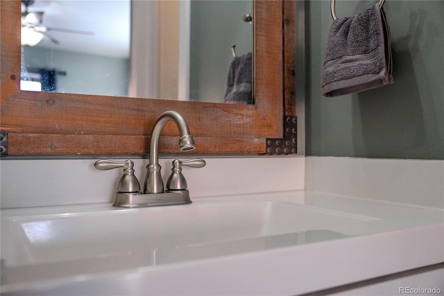 room details featuring a ceiling fan and a sink