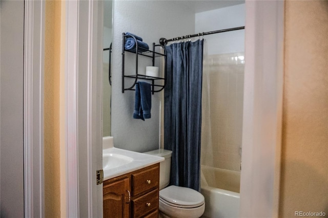 full bath with vanity, toilet, and shower / bath combo with shower curtain