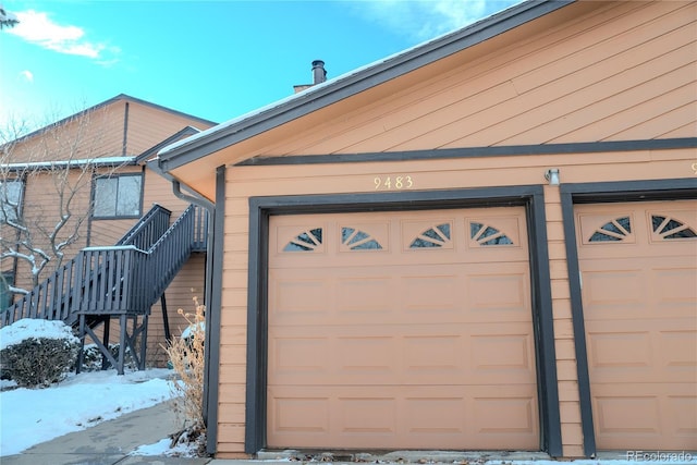 view of snow covered garage