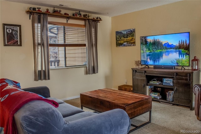 carpeted living room featuring visible vents, baseboards, and a textured ceiling