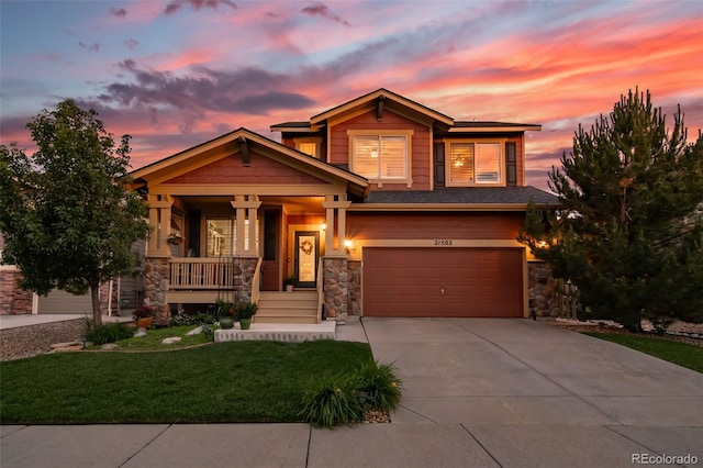 21502 E Idyllwilde Dr, Parker, CO 80138 - craftsman house featuring stone siding, covered porch, and an attached garage