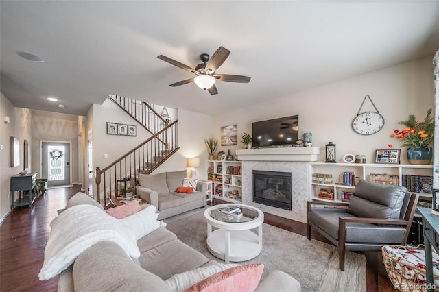 21502 E Idyllwilde Dr, Parker, CO 80138 - living area featuring wood finished floors, stairway, a fireplace, a ceiling fan, and recessed lighting