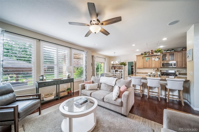 21502 E Idyllwilde Dr, Parker, CO 80138 - living area featuring dark wood-style floors, plenty of natural light, ceiling fan, and recessed lighting