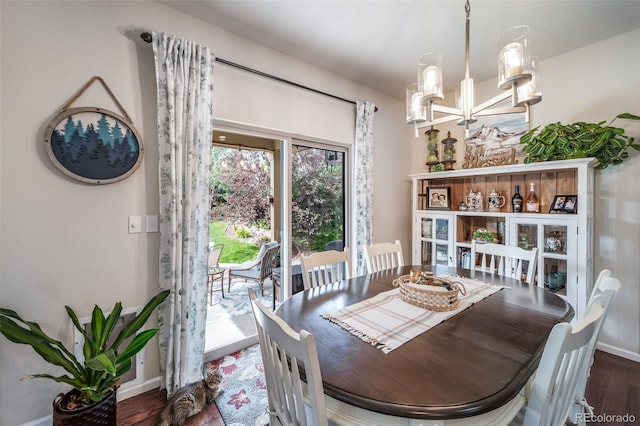 21502 E Idyllwilde Dr, Parker, CO 80138 - dining room featuring wood finished floors and a chandelier