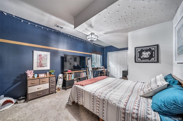 21502 E Idyllwilde Dr, Parker, CO 80138 - bedroom featuring carpet flooring, a textured wall, and a closet