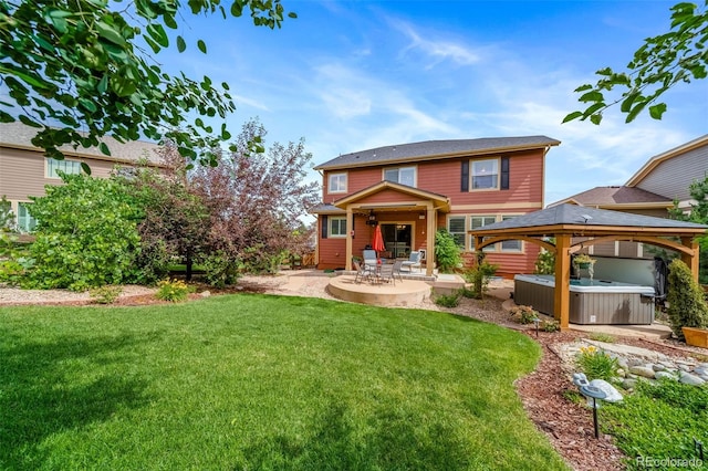 21502 E Idyllwilde Dr, Parker, CO 80138 - back of property featuring a hot tub, a patio area, a gazebo, and a lawn