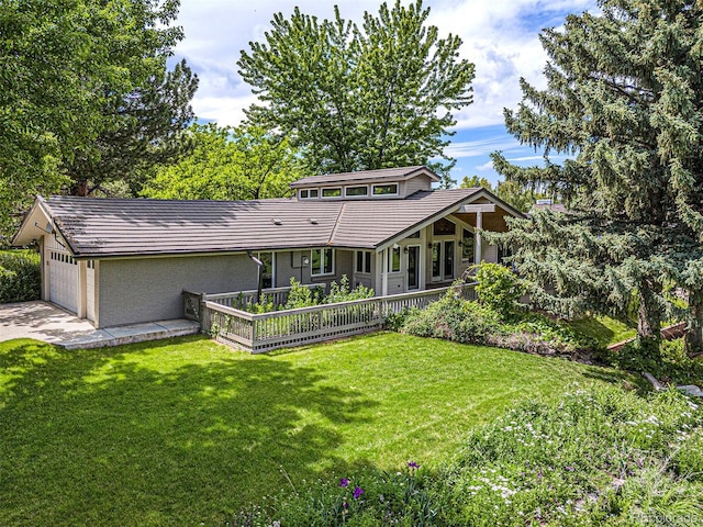 78 Fairway Ln, Littleton, CO 80123 - rear view of house with a yard, a garage, driveway, and a tile roof
