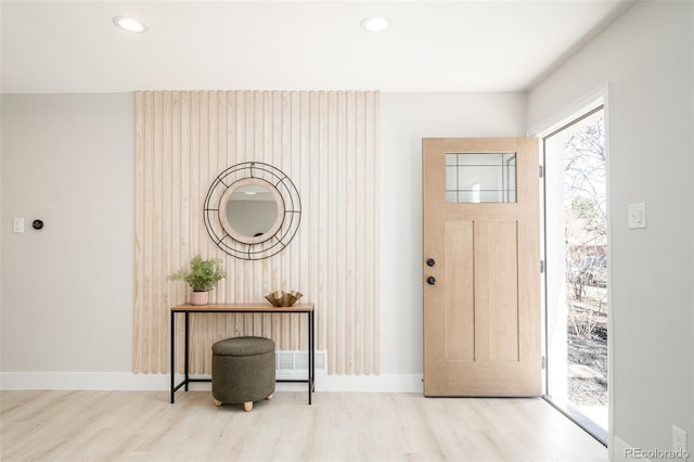 entrance foyer featuring recessed lighting, baseboards, and wood finished floors