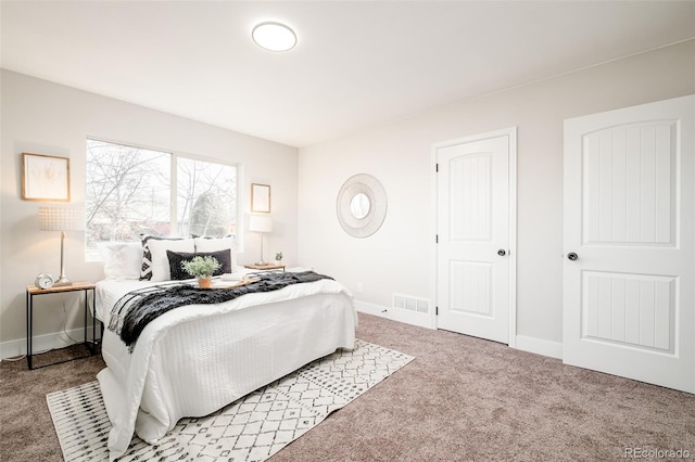 bedroom with visible vents, baseboards, and carpet flooring