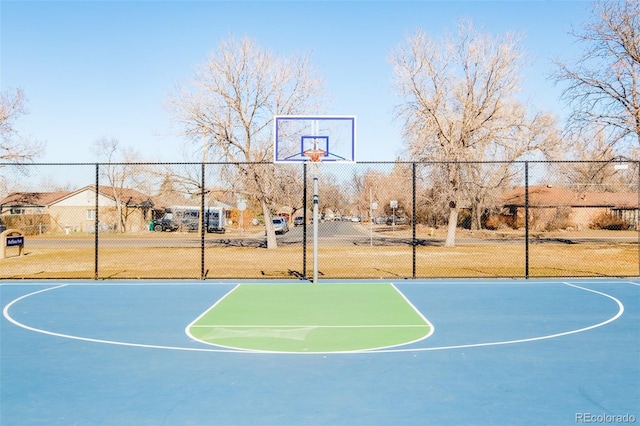 view of sport court featuring community basketball court and fence