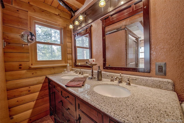 bathroom featuring vanity, wood ceiling, and vaulted ceiling