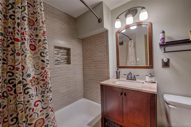 full bathroom with shower / bath combination with curtain, vanity, and toilet