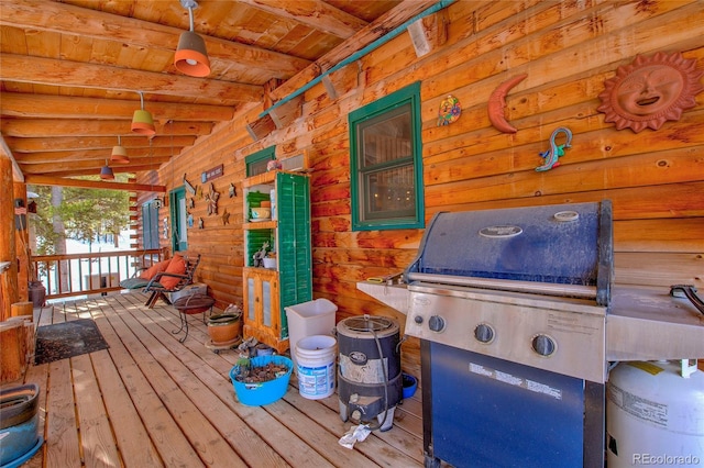 wooden deck with a grill