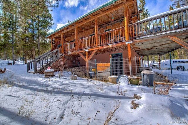 view of snow covered house