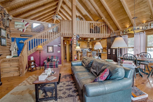 living room featuring ceiling fan, wooden ceiling, beamed ceiling, high vaulted ceiling, and hardwood / wood-style flooring