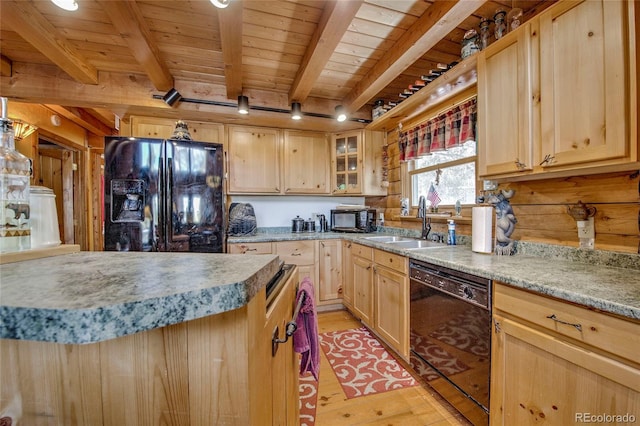 kitchen featuring light brown cabinetry, sink, black appliances, light hardwood / wood-style flooring, and beamed ceiling