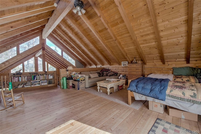 bedroom with beam ceiling, hardwood / wood-style flooring, high vaulted ceiling, wooden ceiling, and wood walls