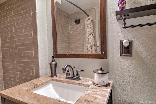 bathroom with vanity and walk in shower