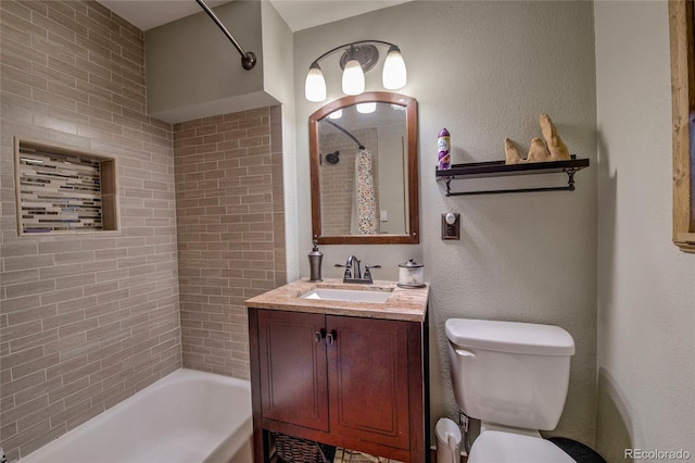 full bathroom featuring vanity, toilet, and tiled shower / bath combo